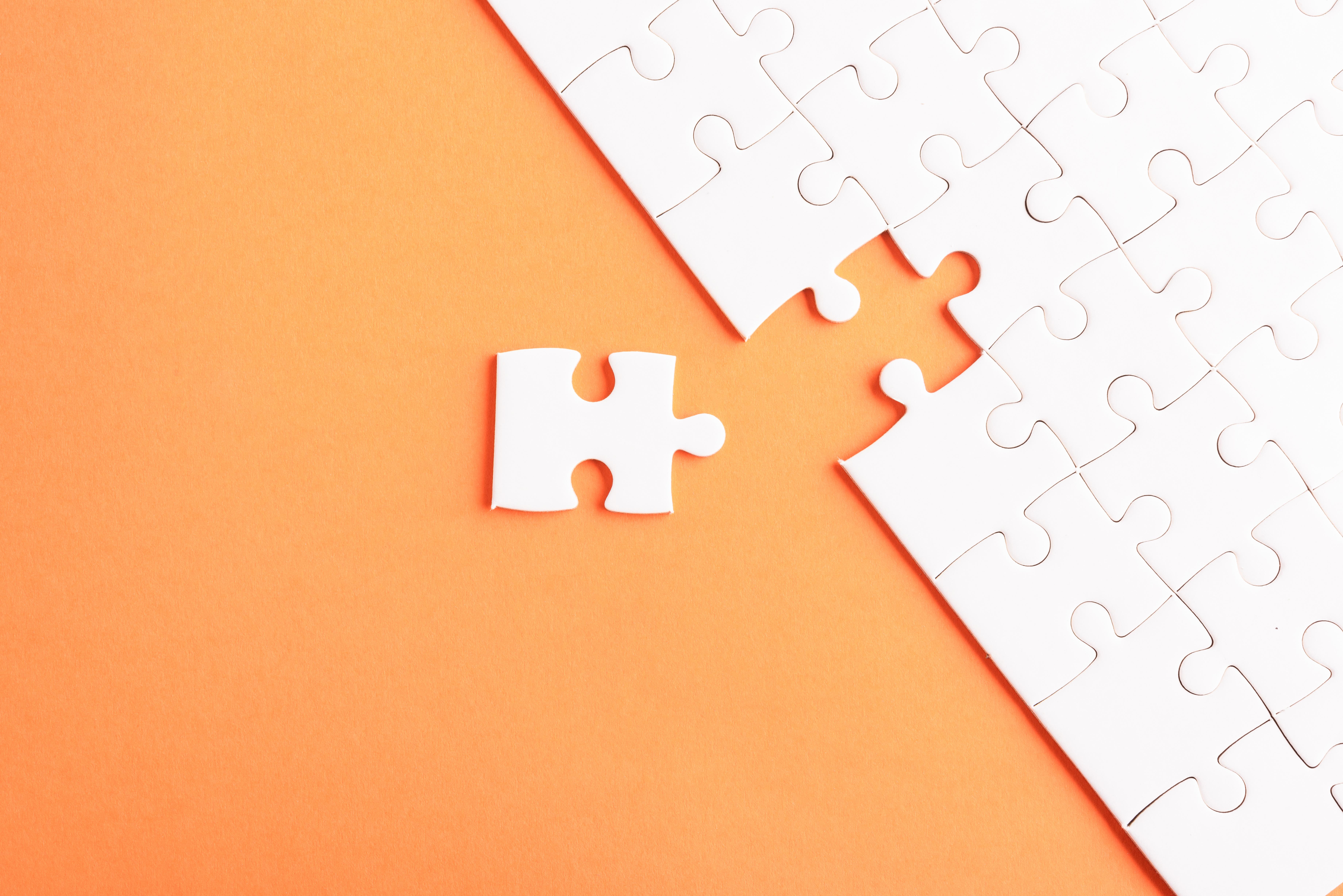 image of puzzle pieces, 1 piece out of place