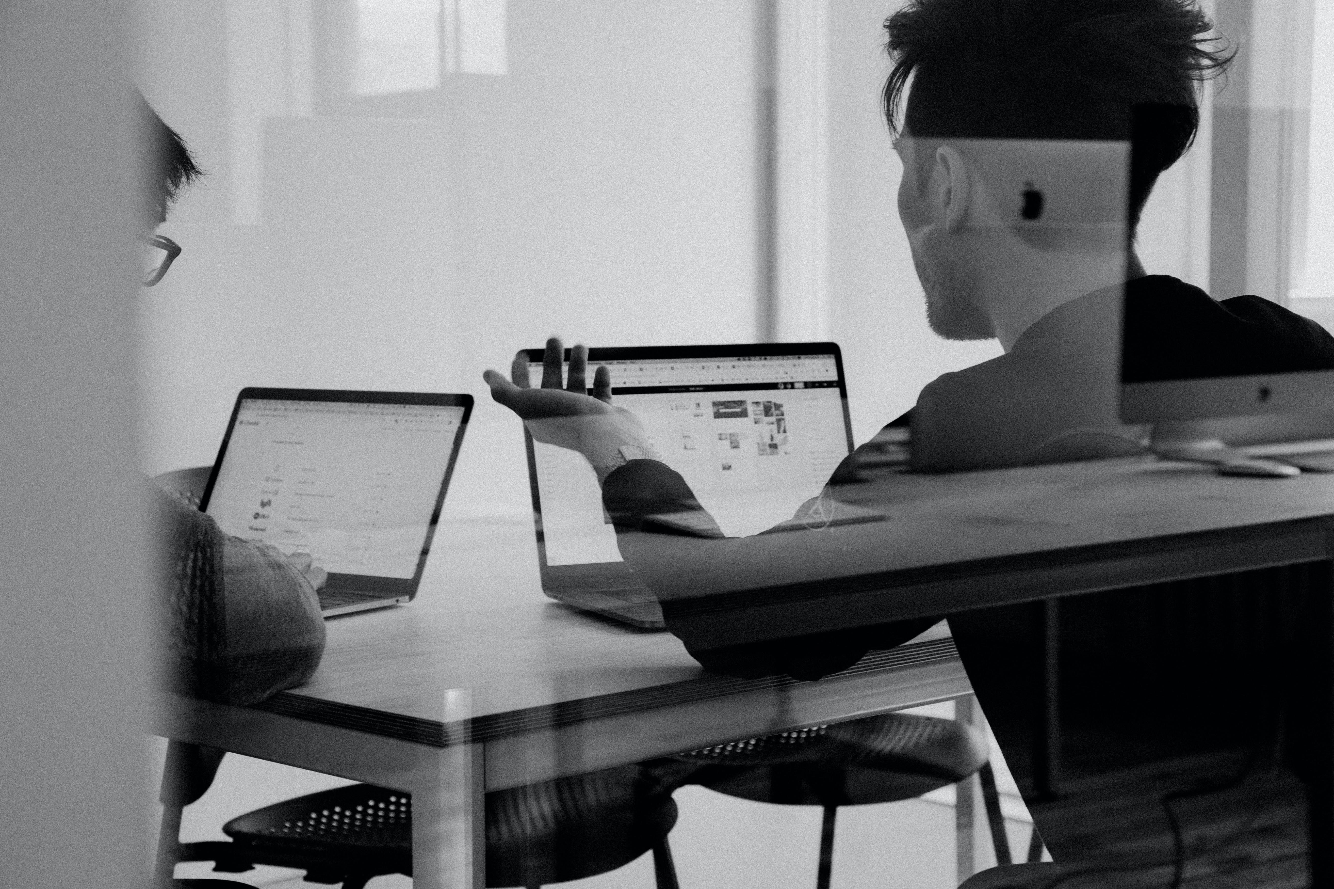 in-person consultation two people at a table 